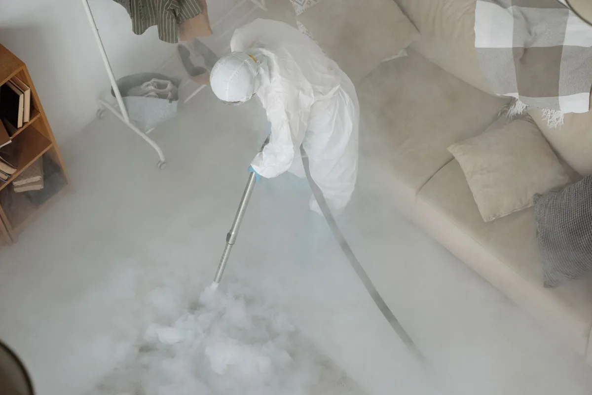 Biohazard cleanup technician in protective equipment, Oak Hill, OH